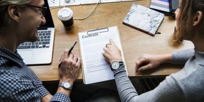 Two people Looking at a CV