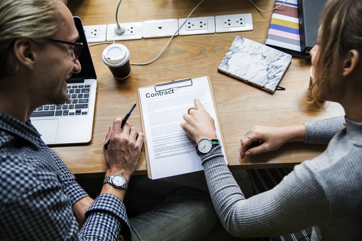 Two people Looking at a CV